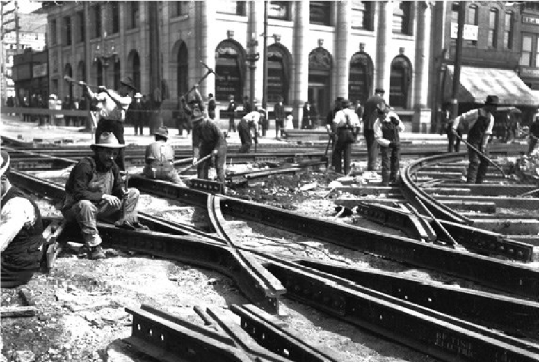 Men constructing trolley tracks